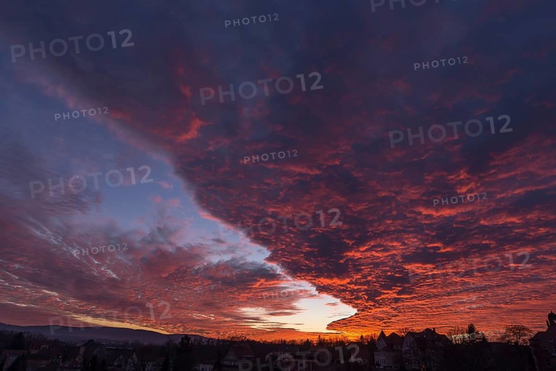 A red evening sky with cumulus clouds (stratocumulus) over Bautzen, Upper Lusatia, Saxony, Germany