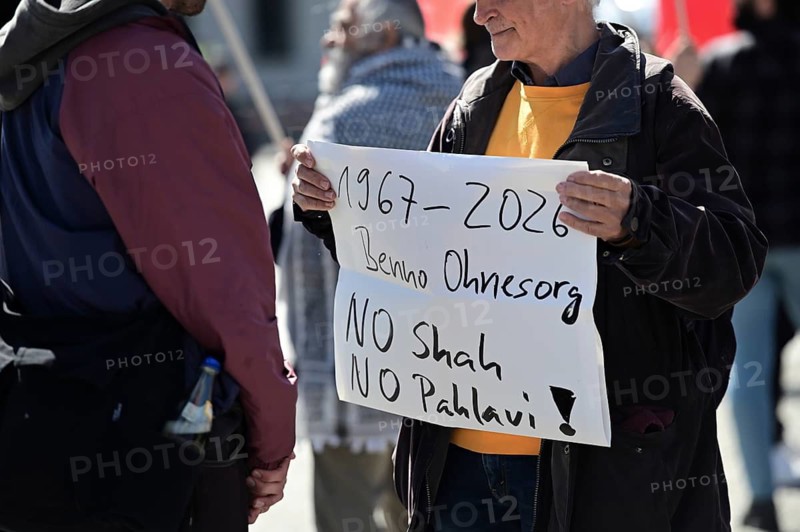 Opponents of Reza Pahlavi are protesting against Pahlavi's visit at Pariser Platz at the Brandenburg Gate. At the same time, supporters of Pahlavi gathered in front of the Reichstag. A demonstrator remembers Benno Ohnesorg