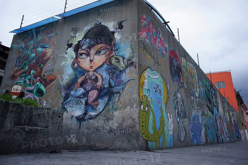 Colourful graffiti art on a concrete wall with imaginative cartoon characters, Quito, Ecuador