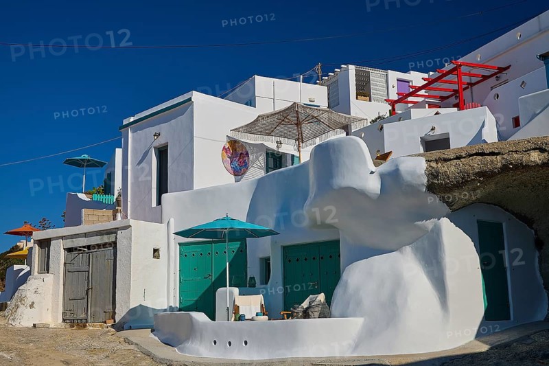 White Mediterranean houses with green decoration built into rocks, Syrmata, boat garages, boathouse, boathouses, beach house, Goupa, Goypa, Goupa Kara, Kimolos, Cyclades, Greek Islands, Greece