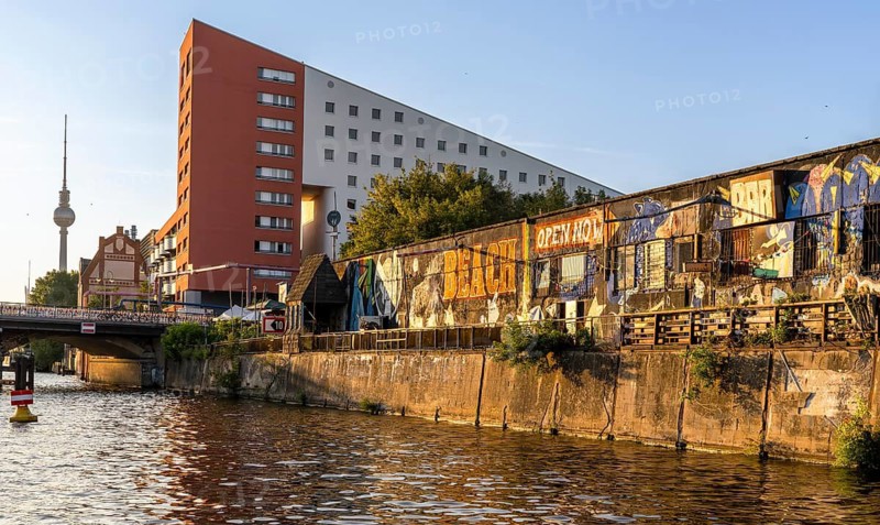 Beach club and residential buildings along Holzmarktstraße in Friedrichshain-Kreuzberg, view from the Spree, Berlin, Germany