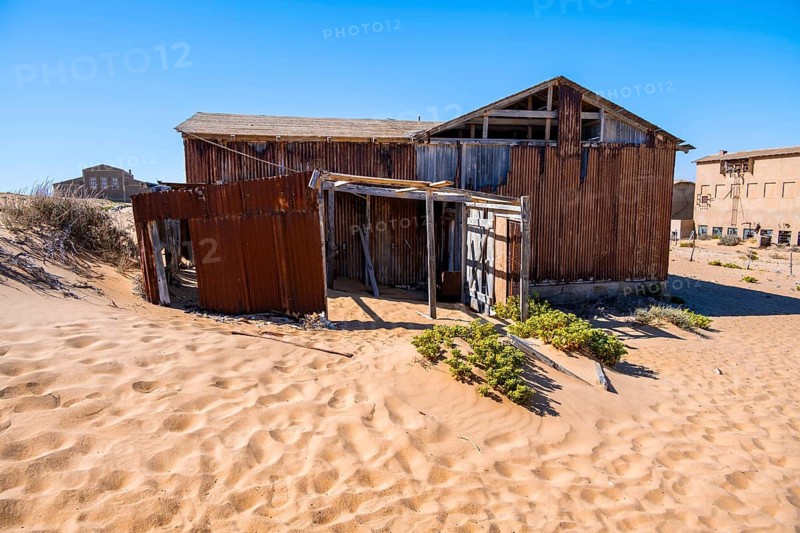 Houses of a former diamond mining town that is slowly sinking into the sands of the Namib Desert, Kolmanskop, Karas, Namibia