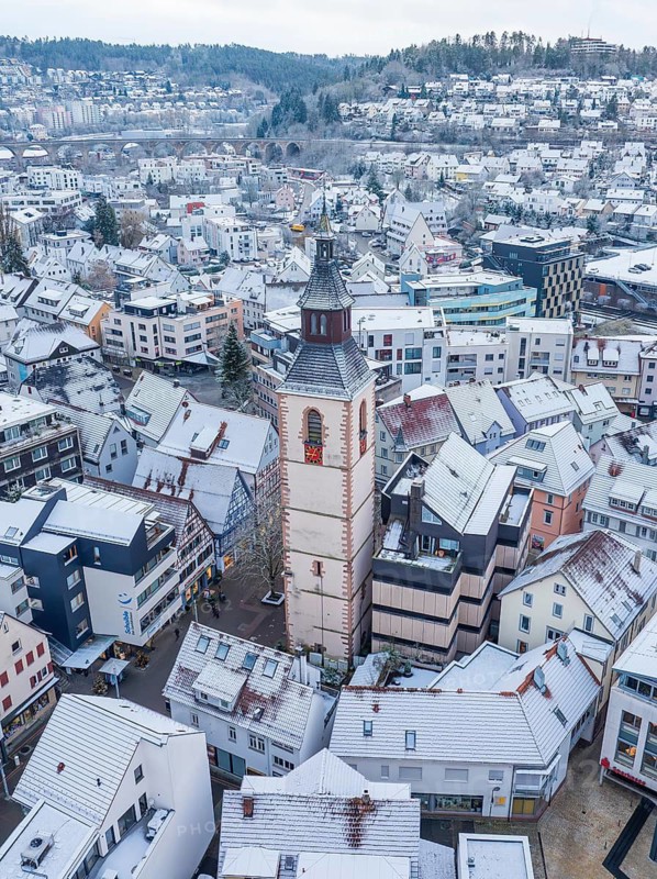Snowy town view with dominating church tower in the background, Nagold, Black Forest, Germany