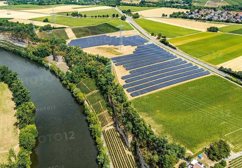 The Neckar near Lauffen. The Talheim PV Park above the impact slope. Solar systems near Talheim, Baden-Württemberg, Germany