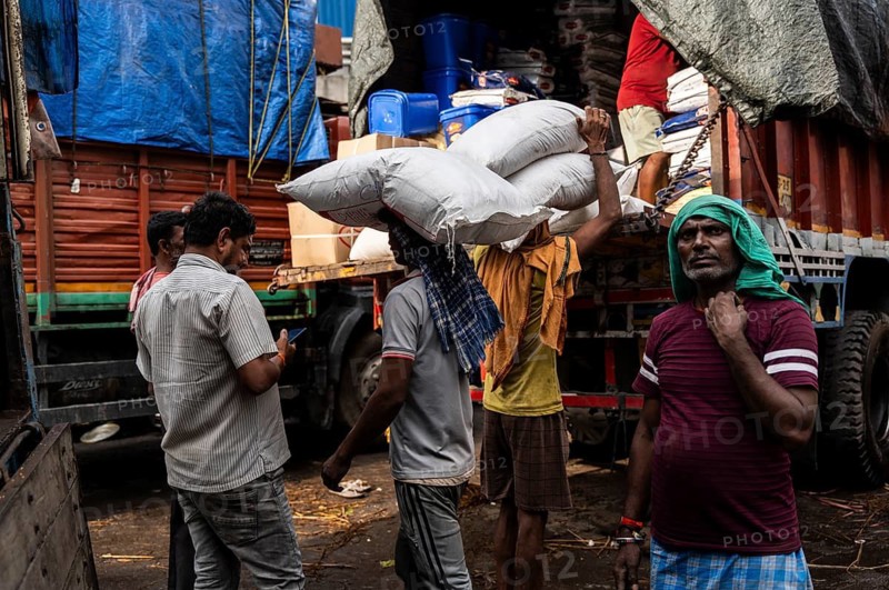 GUWAHATI, INDIA - MAY 1: Labourers carries goods in a wholesale market, in Guwahati, India, on May 1, 2025. May Day or Workers Day is a global holiday celebrated on May 1st to honor workers and their contributions