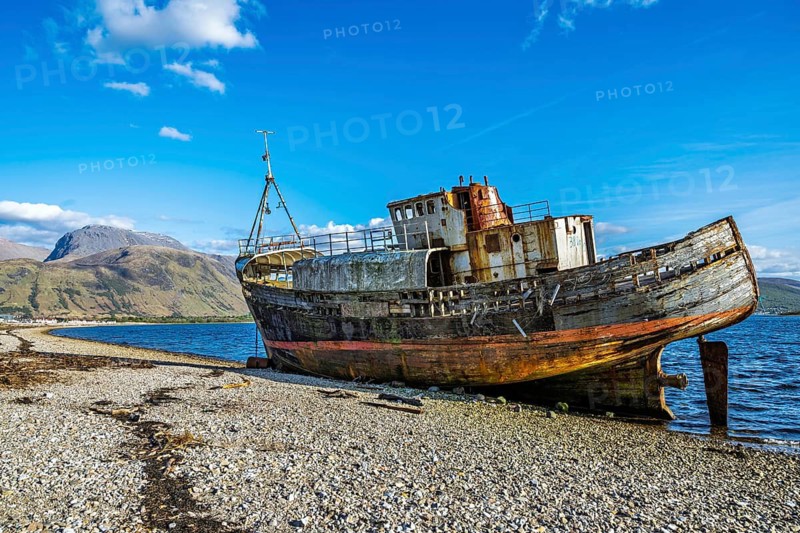 Corpach Wreck or Old Boat of Caol and Nevis Range Mountains, Caol Beach, Corpach, Fort William, Highland, Scotland, UK