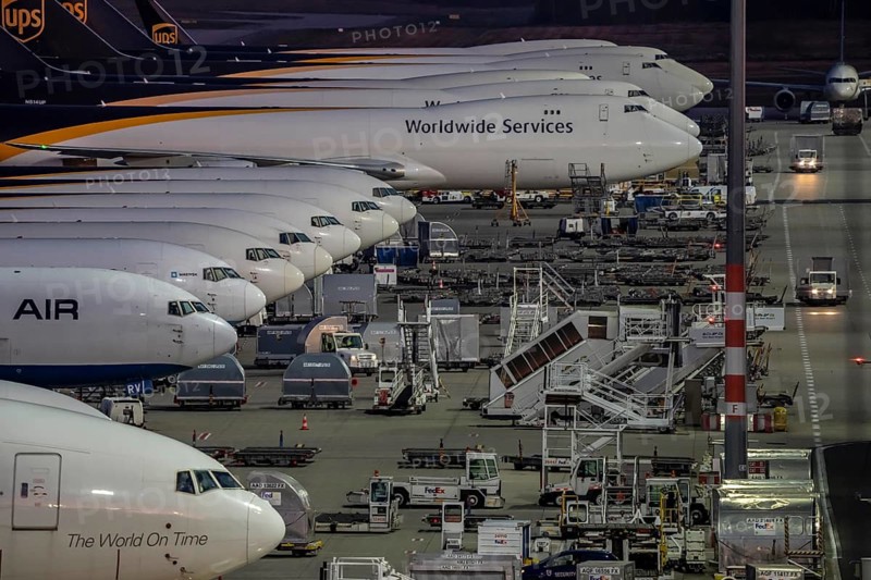 Cologne-Bonn airport, CGN, air freight center, UPS Logisic Hub, UPS cargo aircraft on the apron, Star Air Cargo aircraft, Maersk, at the logistics center, in the evening