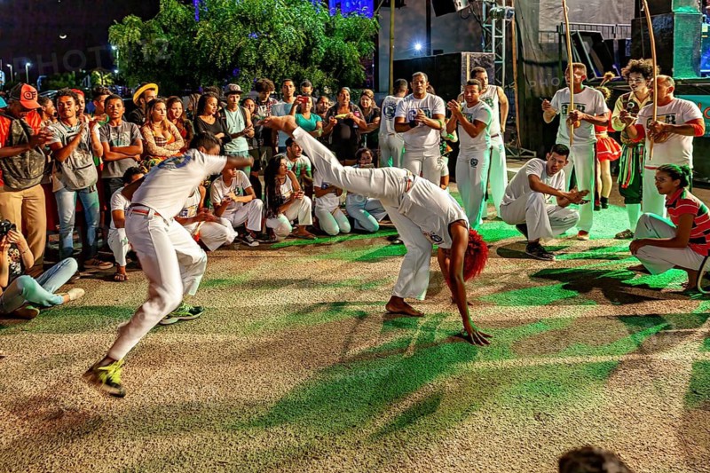 Two capoeira fighters show quick movements in a thrilling performance, The Capoeira Battle Dance at a small festival in Petrolina Brazil