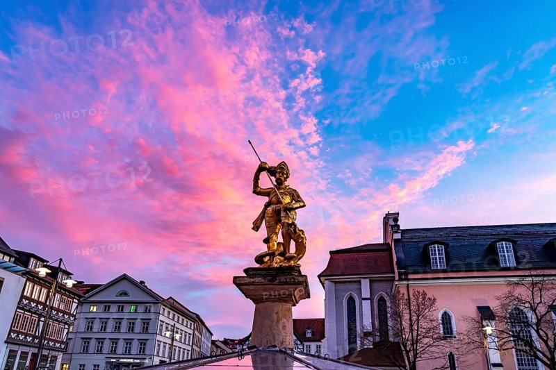 The golden town saint St George on the Georgsbrunnen fountain on the market square in Eisenach, Thuringia, Germany