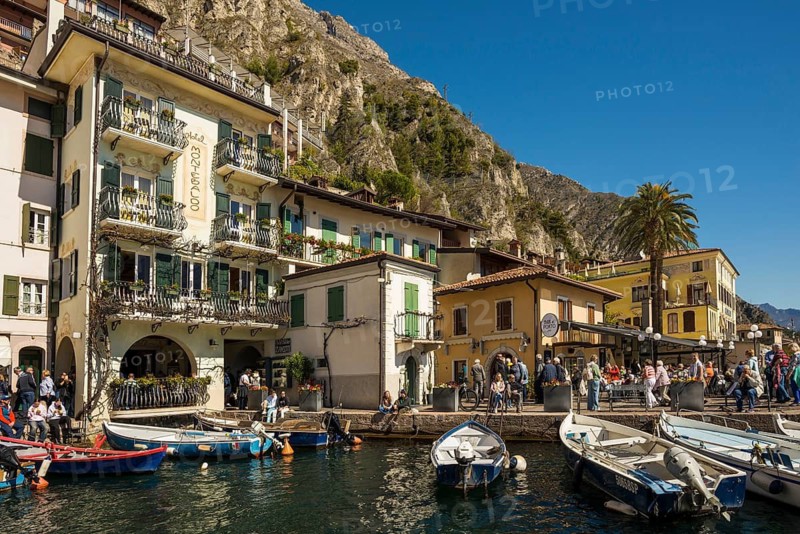Picturesque village and colorful houses on the lake and steep mountains, Limone sul Garda, Lake Garda, Brescia province, Lombardy region, Italy