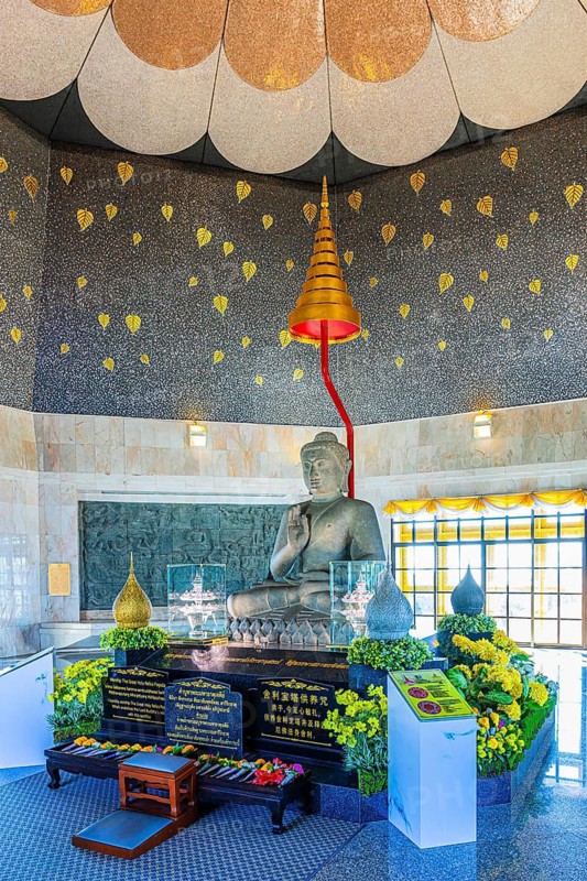 Buddha statue in modern temple room with golden decorative elements, Queen Pagoda, Doi Inthanon National Park, Chiang Mai Province, Thailand