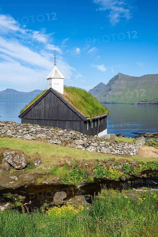 Funningur wooden church, church with grass roof on the fjord, Eysturoy island, Faroe Islands, Denmark