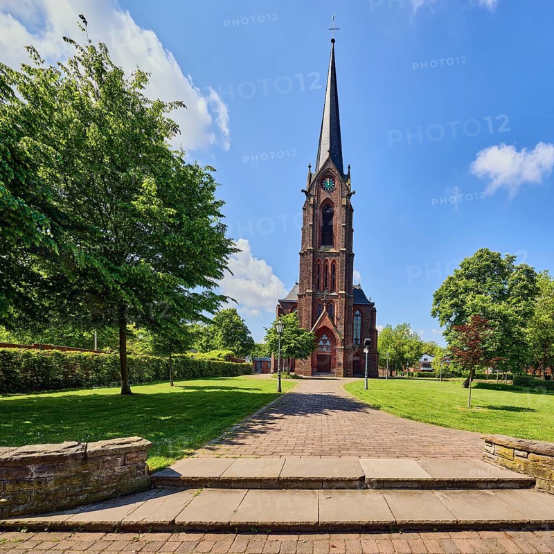 St. Nicholas parish church, church tower, sandstone wall, staircase, green area Bürgerpark, lawn, path, trees, blue sky, cumulus clouds, Aldekerker Straße, Rathausstraße, Rheurdt, Kleve district, North Rhine-Westphalia, Germany