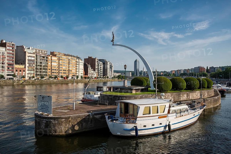 View of the banks of the Meuse with marina and the sculpture Le Plongeur et son arc, Liège, Belgium