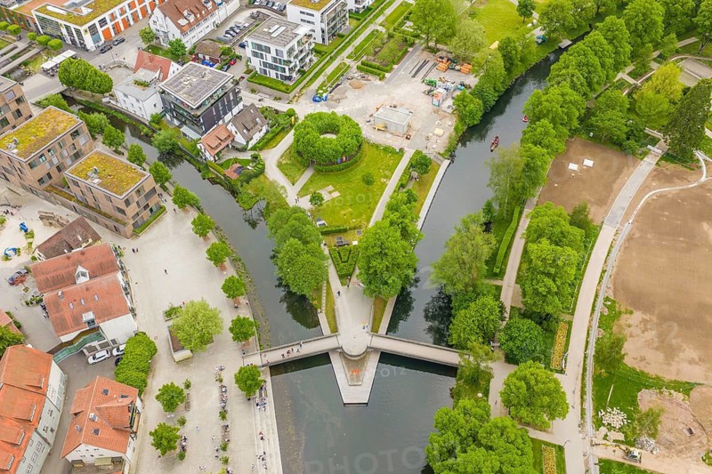 Urban aerial view with river and buildings surrounded by green spaces, European market and garden fair, Nagold, Calw district, Germany
