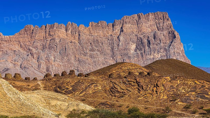 Round tombs made of unhewn stones, beehive tombs, behind the Jebel Misht mountain range, near the town of Al Ayn, Arabian Peninsula, Sultanate of Oman