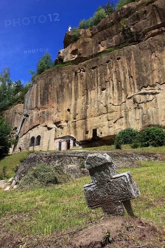 Corbii de Piatra rock monastery, stone ravens carved into a massive, 30-meter high sandstone wall, village of Jgheaburi, municipality of Corbi, in the district of Argesin, Wallachia, Romania