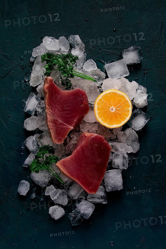 Fresh, raw steak, tuna fish, on ice, top view, close-up