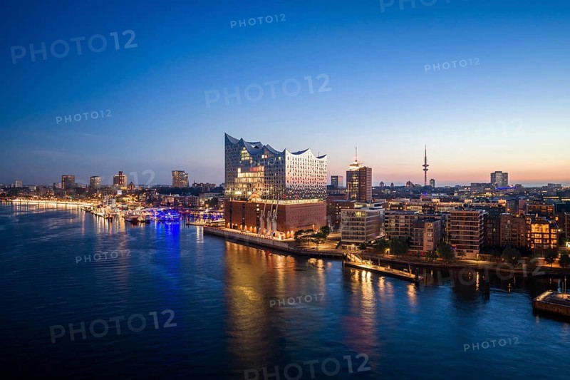 Aerial view of sunrise on the Elbe with Elbe Philharmonic Hall and reflections in the glass façade, Hamburg, Germany
