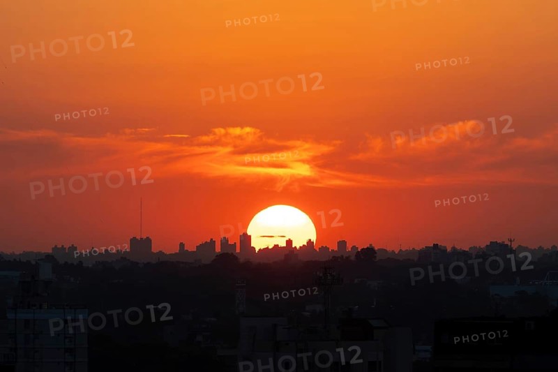 Sunset with skyline of a big city, symbol of heat, climate change and global warming, Buenos Aires, Argentina