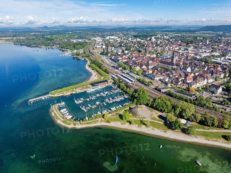 Aerial view of the town of Radolfzell on Lake Constance with the Wäschbruckhafen, harbour pier and concert sail, on the horizon the Hegauberge, district of Konstanz, Baden-Württemberg, Germany
