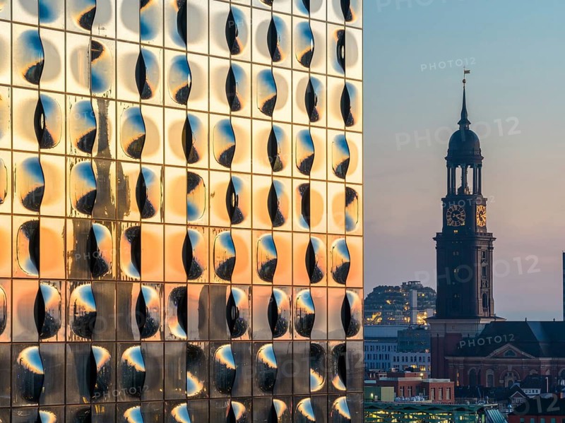 Aerial view of the sunrise on the Elbe with Elbe Philharmonic Hall and St Michael's Church (Michel), Hamburg, Germany
