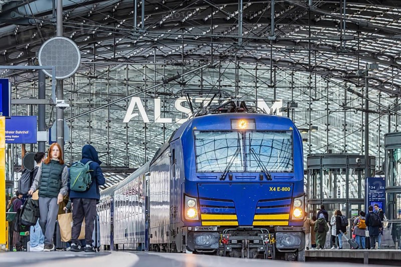 EuroCity to Warsaw at Berlin Central Station. Travelers on the platform. Berlin, Germany