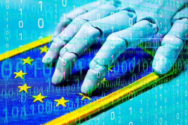 Robot hand on EU flag with binary code, AI laws and AI guidelines, photo montage +++ editorial use only