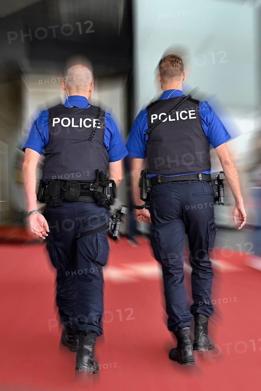 Wipe-clean image of policemen on patrol