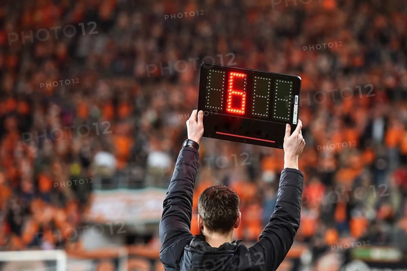 Technical referee shows 6 minutes added time during the football match.