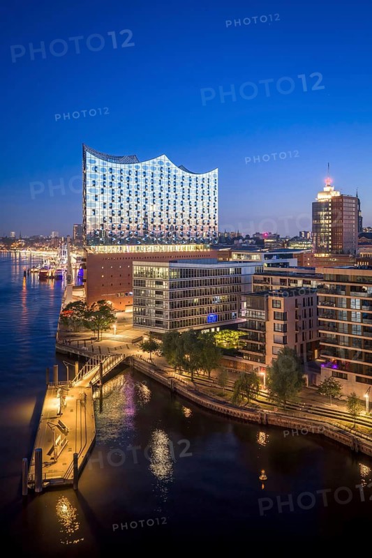 Aerial view of sunrise on the Elbe with Elbe Philharmonic Hall and reflections in the glass façade, Hamburg, Germany