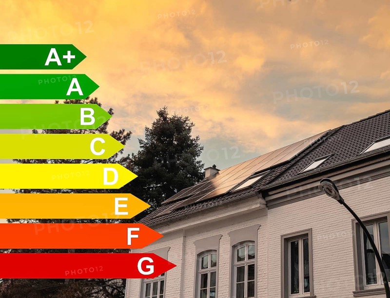 Energy efficiency classes, solar panels in the sunset on the roof of a detached house in Düsseldorf, Germany