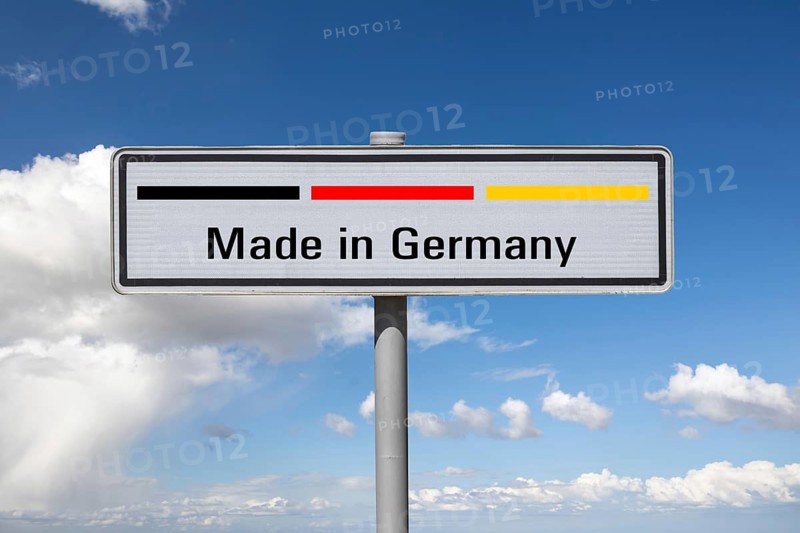 (photo montage) sign with the inscription MADE IN GERMANY against a blue sky