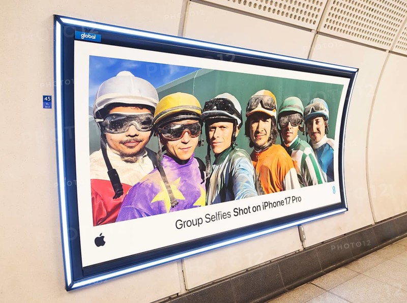 Advertising poster for Group Selfies Shot on iPhone 17 Pro, Transport for London (TfL) underground train station, London, England, UK