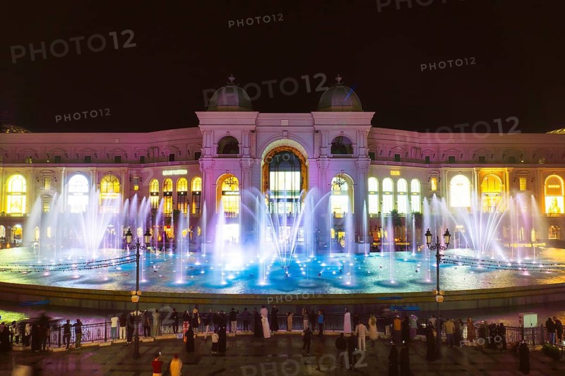 Doha, Qatar - 15th january 19th, 2026: Illuminated Place Vendome Mall at night with reflecting pool and fountains showcasing luxury retail architecture urban nightlife premium lifestyle Qatar