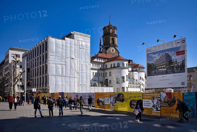 Construction site, construction fence, advertisement for DIBAG PATIO project, pedestrians, passers-by, people strolling on Königsstraße, behind collegiate church, pedestrian zone, Stuttgart, Baden-Württemberg, Germany