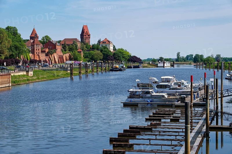 The river Tangier at the harbour of Tangermünde in front of the city wall and the old town and the church of St. Stephan. Hanseatic town of Tangermünde, Saxony-Anhalt, Germany