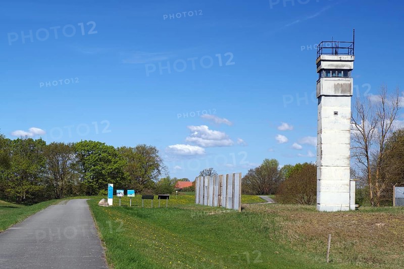 An old watchtower next to a road in a rural landscape, GDR border, Neu-Bleckede, spring, bicycle tourism, bicycle travel, Mecklenburg-Western Pomerania, Germany