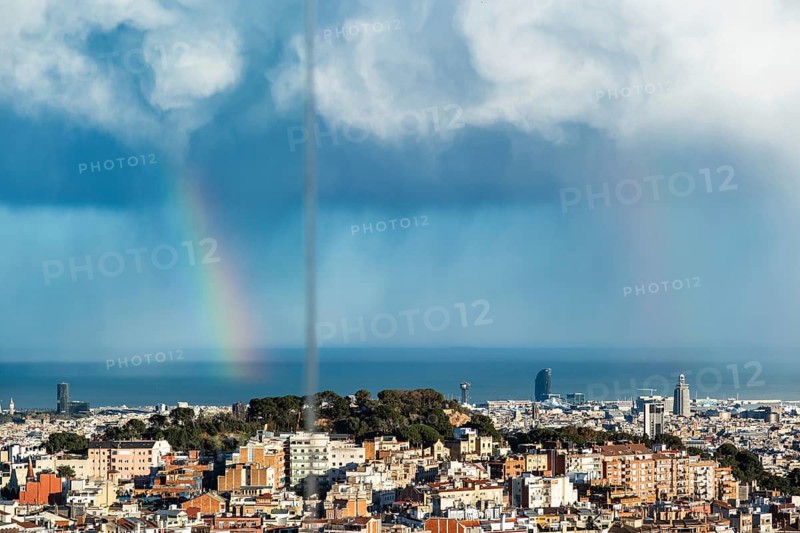 Storm clouds and rainbows over Barcelona, Spain
