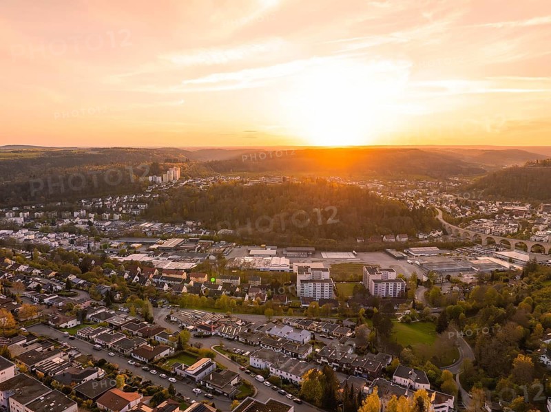 Panoramic view of a town at sunset with settlements and hills, Nagold, district of Calw, Germany