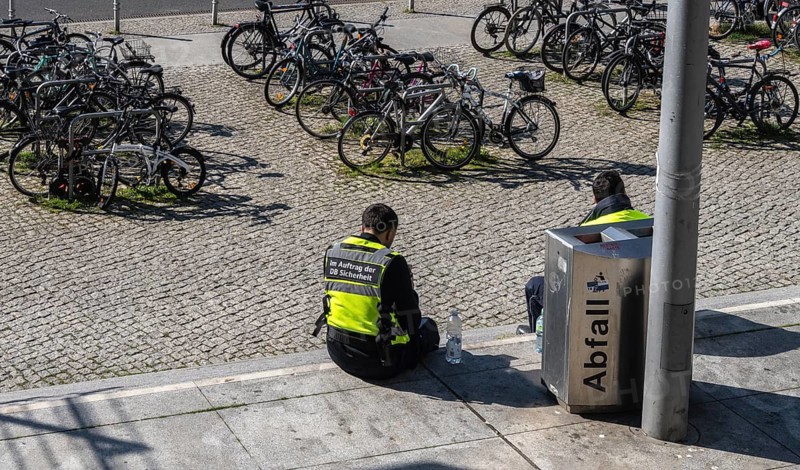 Everyday scenes, travelers and railway employees as well as the interior design, signs, signposts and the DB travel center, in and at Berlin Central Station, Germany