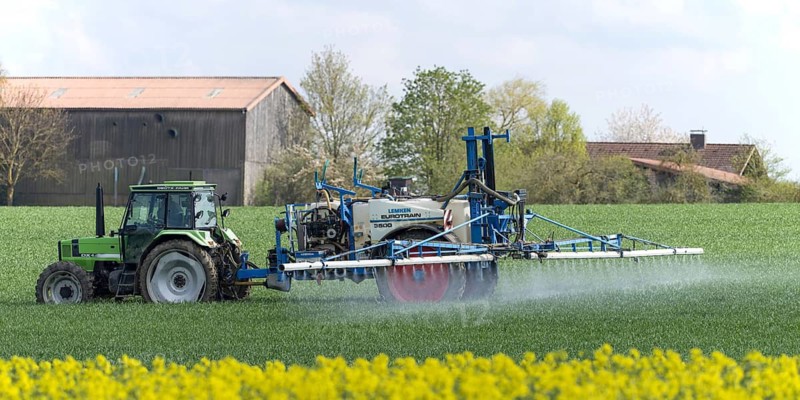 Agriculture, pesticide being sprayed on a field in spring, Swabian Alb, Baden-Württemberg, Germany