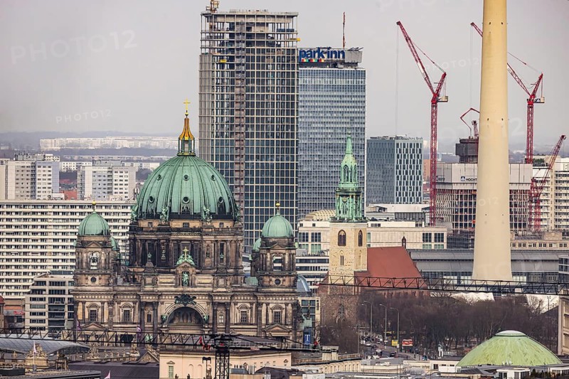 City view of Berlin. View of the capital from the observation deck in K o l l h o f f t o w e r. View of Alexanderplatz in Berlin. Berlin Cathedral. Covivio-Tower construction site and The Berlinian. When completed, the tower should be 146 meters high. Berlin, Germany