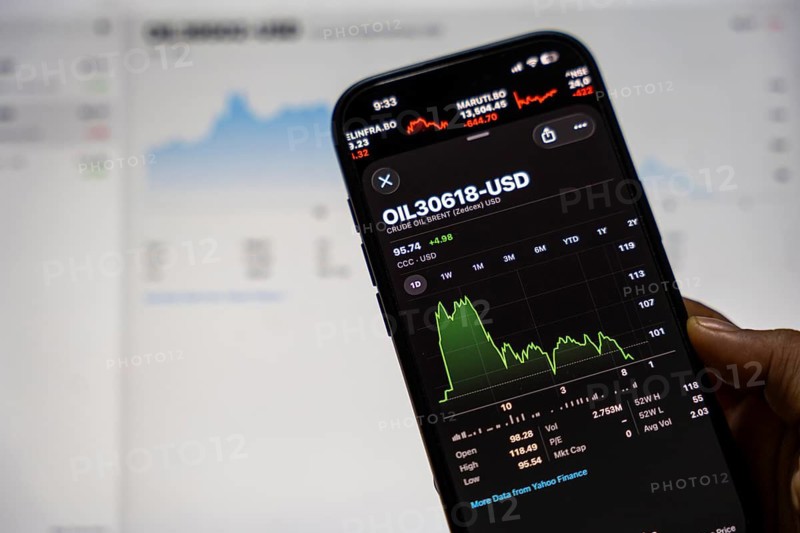 In this photo illustration, a smartphone displays the crude oil price in USD on March 09, 2026 in Guwahati, India. Global oil prices surged to their highest level since 2022 after escalating tensions in the US-Israel conflict with Iran raised concerns over potential disruptions to energy supplies, pushing Brent crude above Dollar 100 per barrel