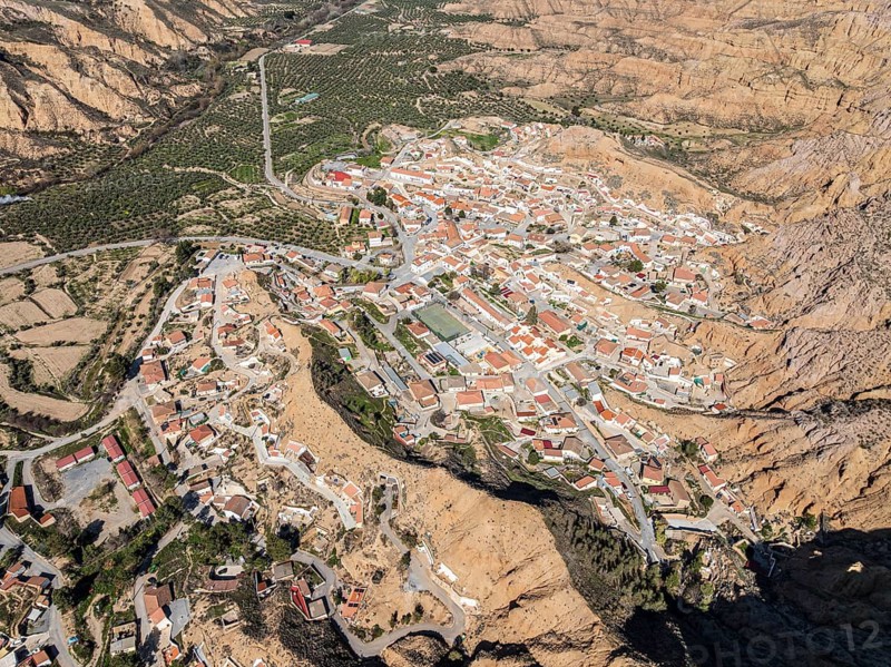 Canyons and gorges near village Gorafe, winding road, aerial view, Gorafe Desert, UNESCO Granada Geopark, Granada province, Andalusia, Spain