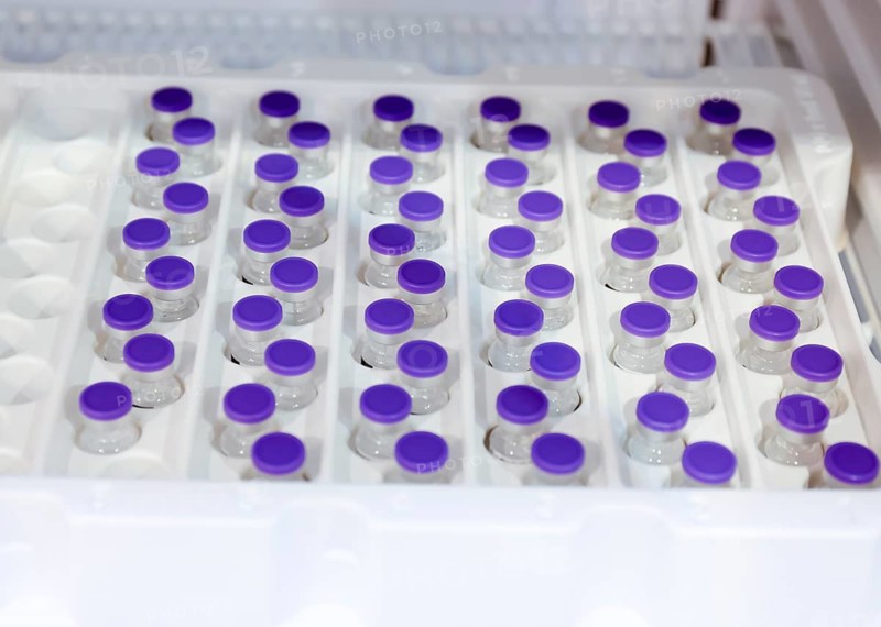 Essen, North Rhine-Westphalia, Germany - Vaccination start at the Corona Vaccination Centre Essen, BioNTech-Pfizer vaccine, ampoules are stored in the refrigerator, 6 vaccine doses are drawn from one ampoule onto vaccination syringes