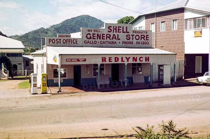 Shell fuel pumps and signage at Redlynch Post Office and General Store, run by Gallo and Cattana families, Cairns, Queensland, Australia 1973