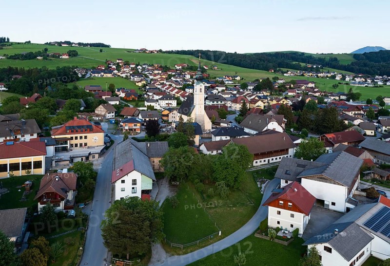 Drone shot, view of village with parish church, Rangersdorf, Mölltal, Carinthia, Austria