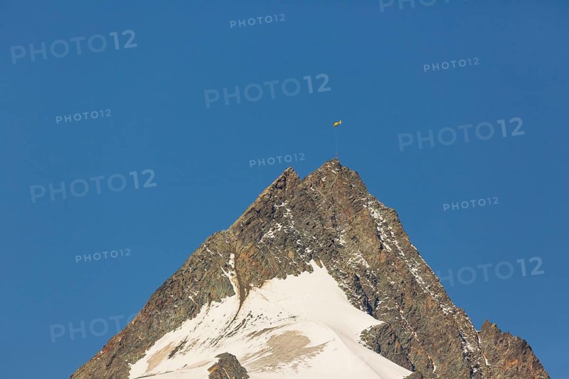 Air rescue. A climber is rescued from the Grossglockner mountain by helicopter
