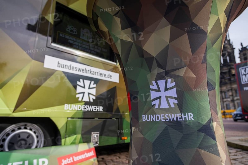In front of the Semper Opera, the Bundeswehr bids farewell to around 700 young officers who, after four and a half months of intensive training, are taking the next step on their way to becoming military executives. Bundeswehr career truck, Dresden, Saxony, Germany